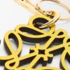 Anagram-berlock i kalvskinn Gult/Guld Anagram-berlock i kalvskinn Gult/Guld