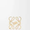 Anagram-brosch i metall Guld Anagram-brosch i metall Guld