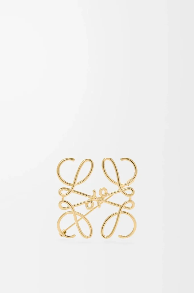 Anagram-brosch i metall Guld Anagram-brosch i metall Guld