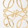 Anagram-brosch i metall Guld Anagram-brosch i metall Guld