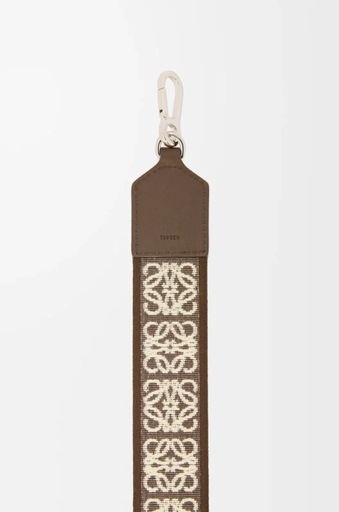 Anagramrem i jacquard och kalvskinn, mörk cigar Anagramrem i jacquard och kalvskinn, mörk cigar