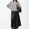 Asymmetrisk kjol i satin nappa lammskinn Svart Asymmetrisk kjol i satin nappa lammskinn Svart
