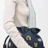 Cats medium Flamenco-clutch i broderad denim Blå Cats medium Flamenco-clutch i broderad denim Blå