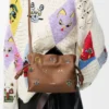 Cats mini Flamenco-clutch i nappa kalvskinn Mocha Cats mini Flamenco-clutch i nappa kalvskinn Mocha