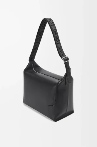 Cubi crossbody-väska i mjukt, slätt kalvskinn och jacquard, svart