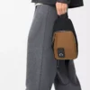 Flex sling i canvas och mocka Svart/mörk guld