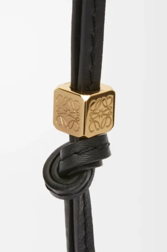 Litet Anagram-band i kalvskinn, svart tonat/guld Litet Anagram-band i kalvskinn, svart tonat/guld