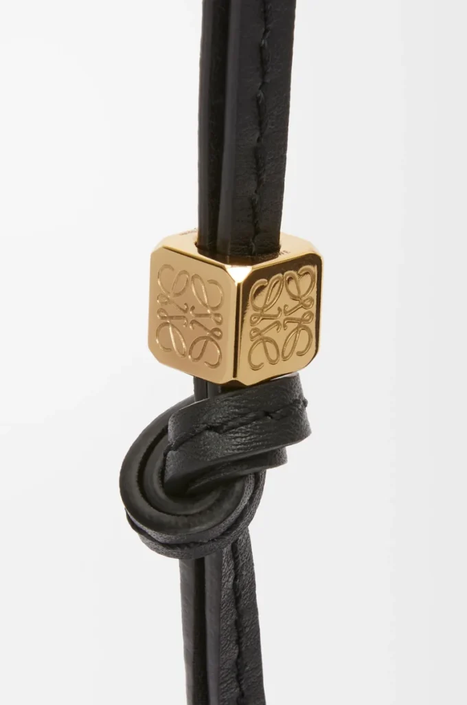 Litet Anagram-band i kalvskinn, svart tonat/guld Litet Anagram-band i kalvskinn, svart tonat/guld