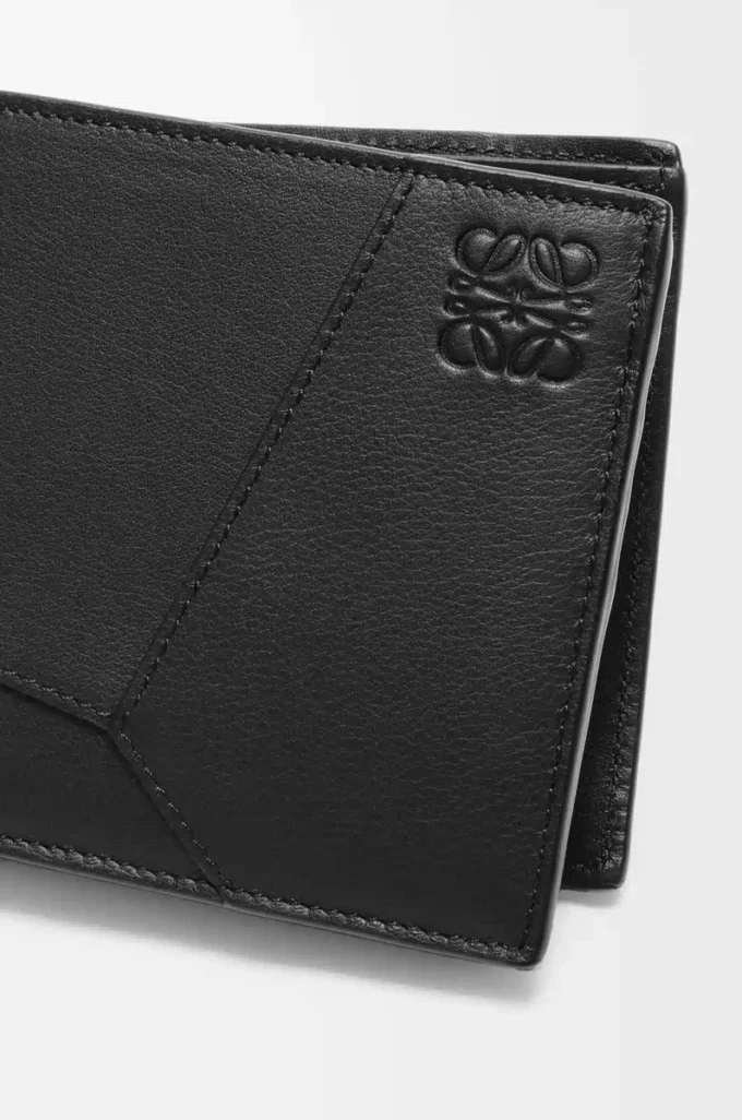 Puzzle bifold-myntplånbok i klassiskt kalvskinn Svart