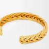 Tunn flätad manschett i sterlingsilver Guld